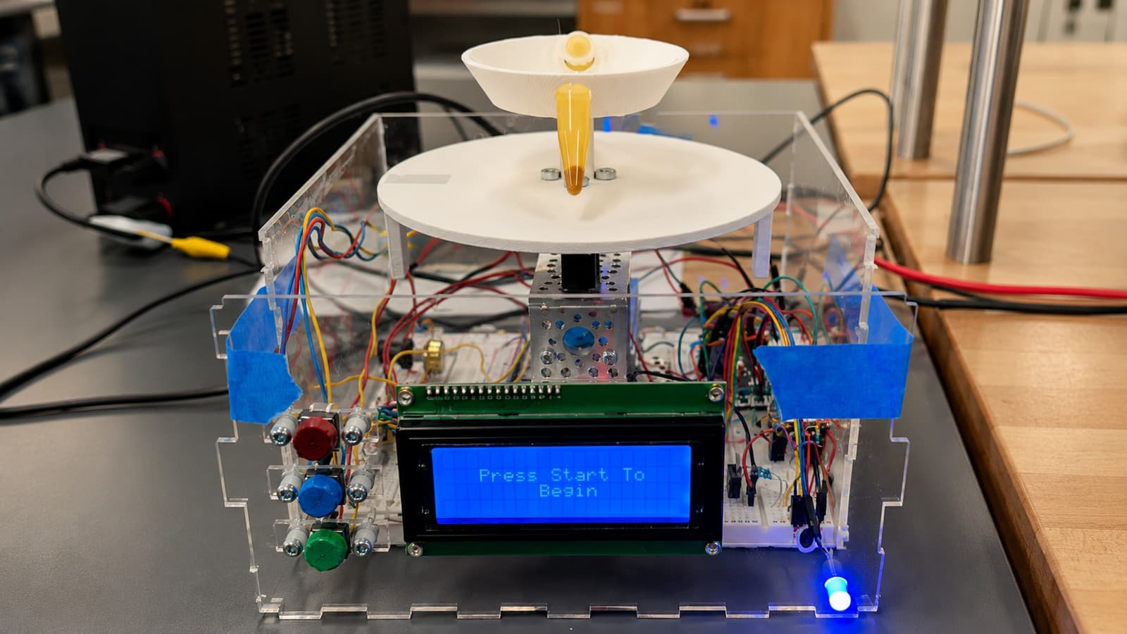 The assembled benchtop centrifuge prototype with its LCD control display reading "Press Start To Begin"
